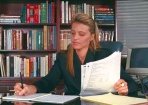 photo of a late 20th century Western professional woman in her office