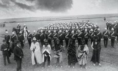 photo of 6 Plains Indian tribal leaders with Canadian government officials and a detachment of Canadian soldiers