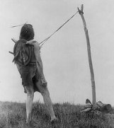 Photo of a Crow Indian performing the Ghost Dance in 1908